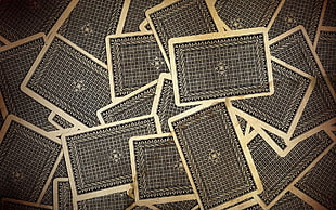 white-and-black floral playing card lot